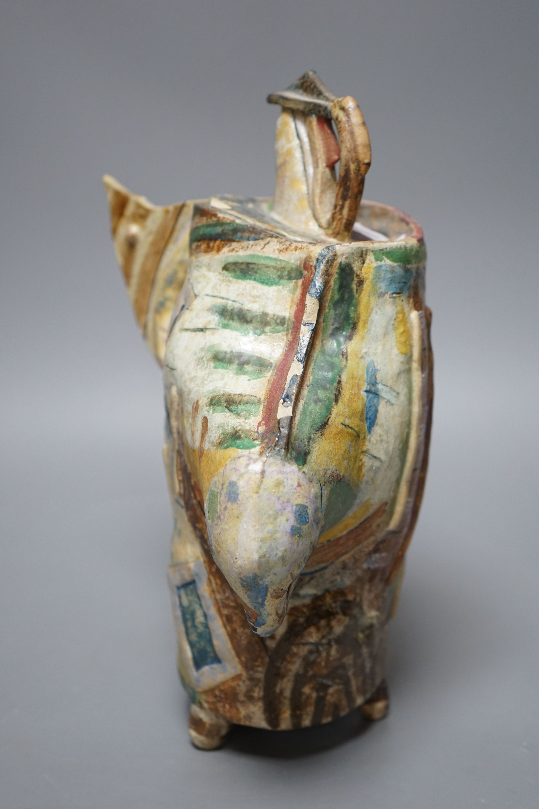 Angus Suttie (1946-1993), an abstract polychrome glazed stoneware jug and cover on tripod base, inscribed ‘Angus 86’, 29cm tall (Damage)